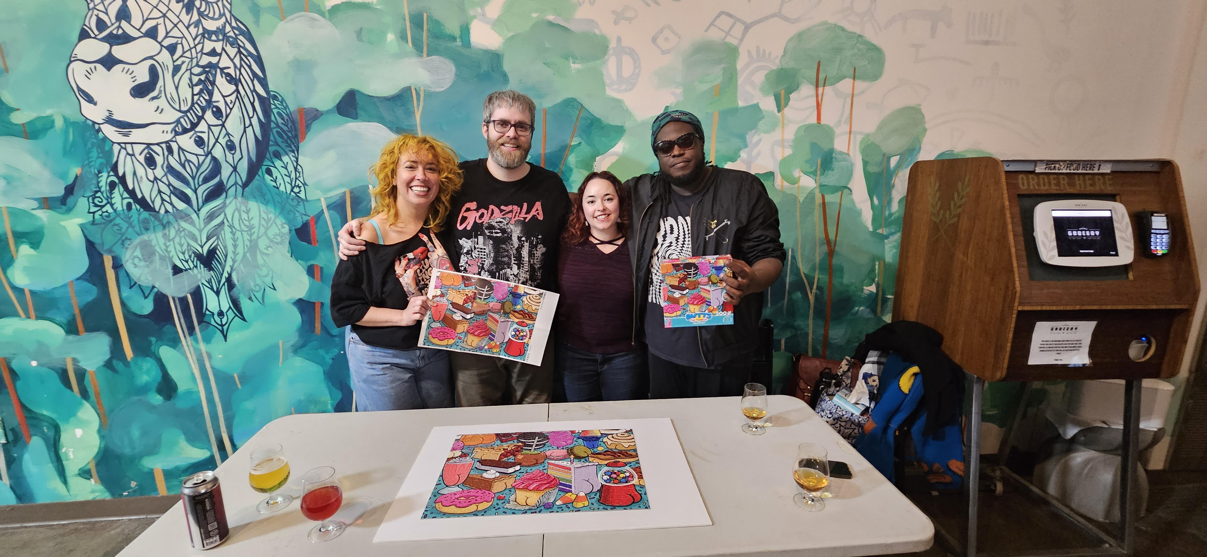 Team posing with puzzle